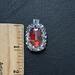 Pendant is approx. 1 inch long and 1/2 wide. 